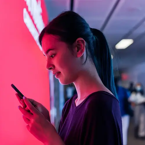 a woman looking at a phone